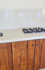a stove top oven sitting on top of a kitchen counter at Studio apartment in the mountains in Santa Marta
