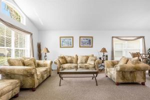 a living room with two couches and a table at 201-4-HB-Beautiful home at TerraVerde in Kissimmee