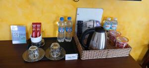 a table with two baskets of bottled water and drinks at Duy Long Hotel in Da Lat