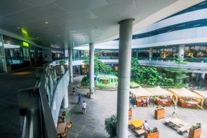 arium of a building with people walking in a mall at Air Residence Penthouse 59 Suite Gym Swim Park 300 mbps in Manila