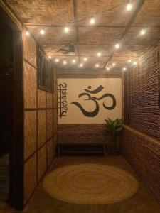 a room with a sign on the side of a wall at General Luna Guest House in General Luna