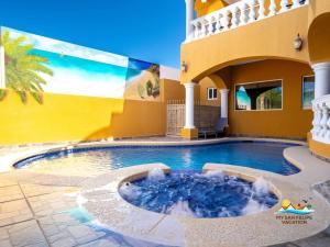 a swimming pool in the middle of a house at Luxury 3-Story Beachside Villa in San Felipe with Private Pool – Casa Mostaza in San Felipe