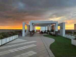 a view of a building with a sunset in the background at Relaxation Getaway in Manila