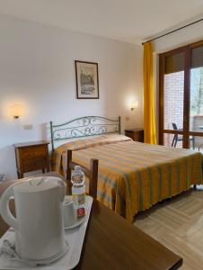 A bed or beds in a room at Hotel I Platani
