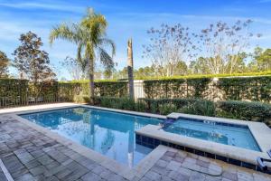 a swimming pool in the backyard of a home at 491-8-LD-Private Pool with Game and Movie in Orlando