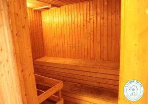 a small wooden sauna with a wooden shelf in it at Nature Home - Swiss Garden Resort Residences - Weekend Free Breakfast in Kuantan +76 photos
