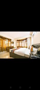 a bedroom with a large bed in a room at rudra cottage in Shimla