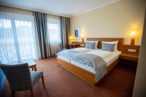 Postel nebo postele na pokoji v ubytování Hotel Stadt Wien + 37 fotografií
