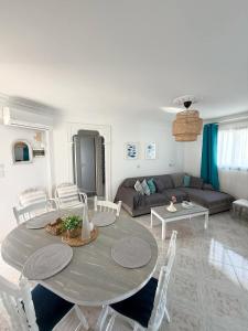 a living room with a table and a couch at Irenes Apartment in Larnaca
