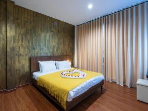 Ένα ή περισσότερα κρεβάτια σε δωμάτιο στο The City Yaowarat Hotel