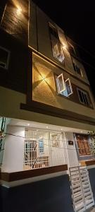 a building with a gate on the side of it at Leela Residency velankanni in Velankanni