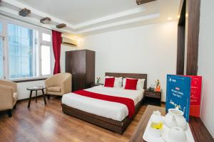 Postel nebo postele na pokoji v ubytování OYO 11474 Gangaur Regency Boutique Hotel