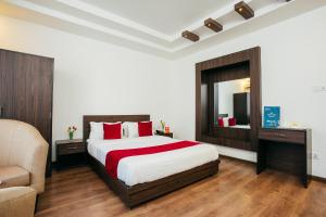 Postel nebo postele na pokoji v ubytování OYO 11474 Gangaur Regency Boutique Hotel