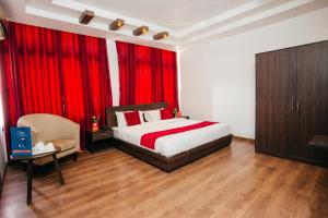 Postel nebo postele na pokoji v ubytování OYO 11474 Gangaur Regency Boutique Hotel