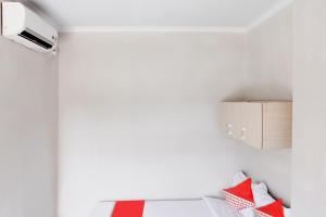 Postel nebo postele na pokoji v ubytování OYO 120 GP Residence