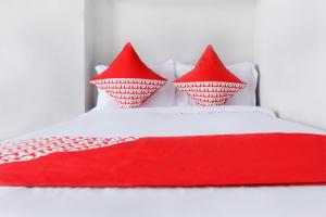 Postel nebo postele na pokoji v ubytování OYO 120 GP Residence
