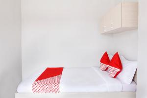 Postel nebo postele na pokoji v ubytování OYO 120 GP Residence