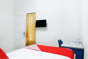 Postel nebo postele na pokoji v ubytování OYO 120 GP Residence