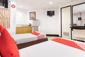 Postel nebo postele na pokoji v ubytování Orange Nest Hotel