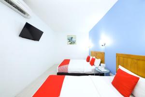 Postel nebo postele na pokoji v ubytování Super OYO 502 Midah Inn Puchong