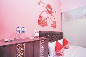 Postel nebo postele na pokoji v ubytování Hotel O Juanda Near Terminal International Juanda