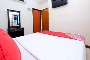 TV a/nebo společenská místnost v ubytování OYO 714 Arina Hotel + 26 fotografií