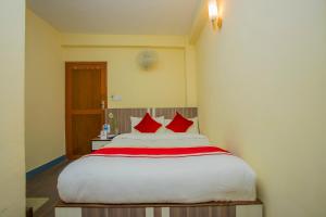 Letto o letti in una camera di OYO 297 Hotel Aayam