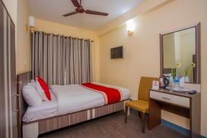 Postel nebo postele na pokoji v ubytování OYO 297 Hotel Aayam