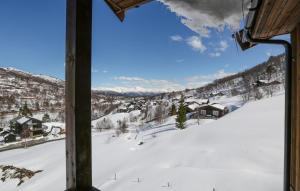 a view of a snowy mountain from a ski lodge at 2 Bedroom Cozy Apartment In Stranda in Stranda
