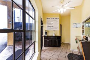 a restaurant entrance with a window and a counter at OYO Hotel San Antonio Lackland near Seaworld in San Antonio