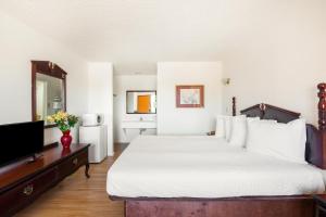 Postel nebo postele na pokoji v ubytování OYO Hotel Groesbeck