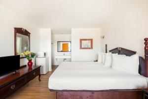 Postel nebo postele na pokoji v ubytování OYO Hotel Groesbeck
