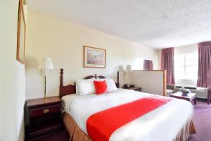 Postel nebo postele na pokoji v ubytování OYO Hotel Tyler Lindale