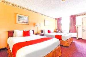 Postel nebo postele na pokoji v ubytování OYO Hotel Tyler Lindale