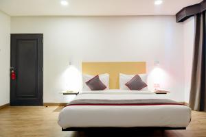 Postel nebo postele na pokoji v ubytování Super OYO Townhouse 1 Hotel Salemba