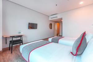 Postel nebo postele na pokoji v ubytování Super OYO Townhouse 1 Hotel Salemba