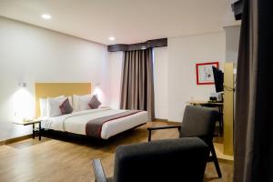 Postel nebo postele na pokoji v ubytování Super OYO Townhouse 1 Hotel Salemba