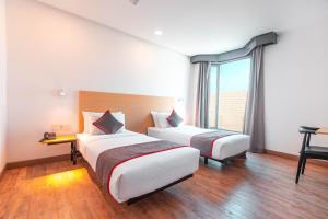 Postel nebo postele na pokoji v ubytování Super OYO Townhouse 1 Hotel Salemba