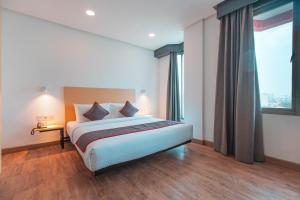 Postel nebo postele na pokoji v ubytování Super OYO Townhouse 1 Hotel Salemba