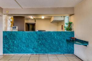 a blue counter top in a hospital lobby at OYO Hotel Jackson North I-55 in Jackson