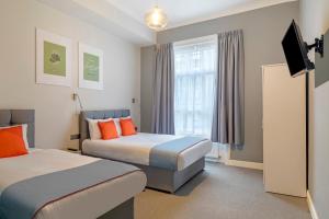 Postel nebo postele na pokoji v ubytování Townhouse Apollo, Hyde Park