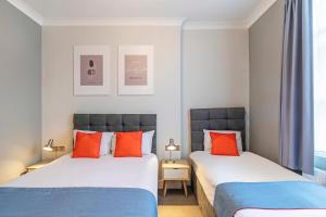 Postel nebo postele na pokoji v ubytování Townhouse Apollo, Hyde Park