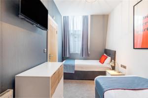 Postel nebo postele na pokoji v ubytování Townhouse Apollo, Hyde Park