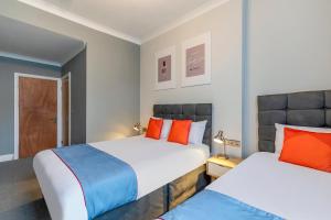 Postel nebo postele na pokoji v ubytování Townhouse Apollo, Hyde Park