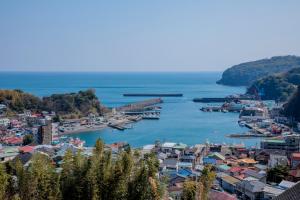 a view of a harbor with boats in the water at Rustic Retreat リトリート真鶴 in Manazuru