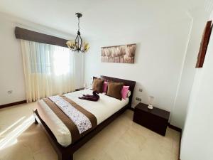 En eller flere senge i et værelse på Casa Tito