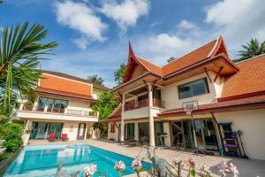 an image of a house with a swimming pool at Kata Sea Cloud Villa半山海景独栋别墅 in Ban Kata