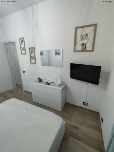 TV a/nebo společenská místnost v ubytování Casa di Teo