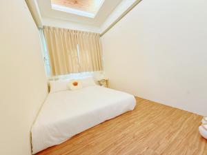 Postel nebo postele na pokoji v ubytování MuyuTime B&B