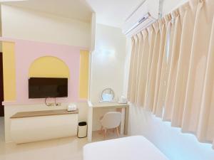 TV a/nebo společenská místnost v ubytování MuyuTime B&B